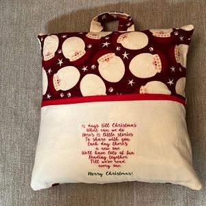 Handmade reading pillow with pocket and Santa design.